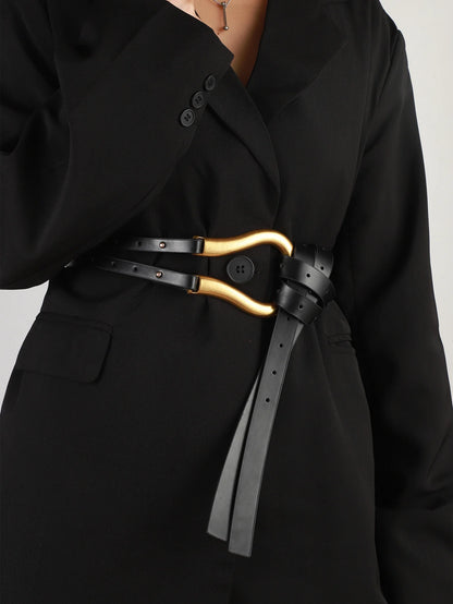 A woman's suit belt with a wide waistband large horseshoe button decoration with skirt belt