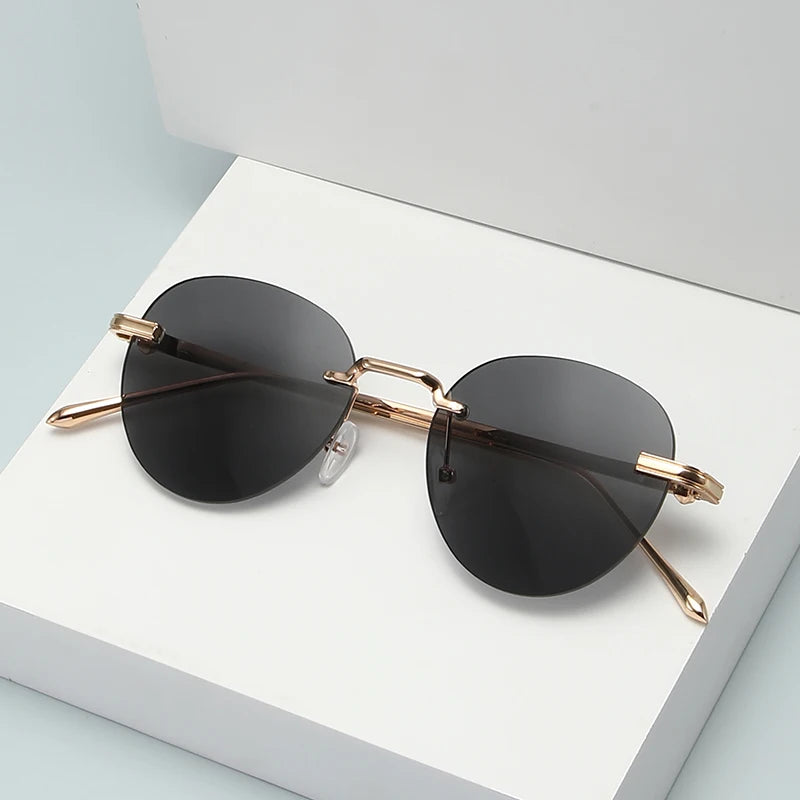 The new frameless and stylishly minimalist sunglasses are versatile with a golden metal frame.